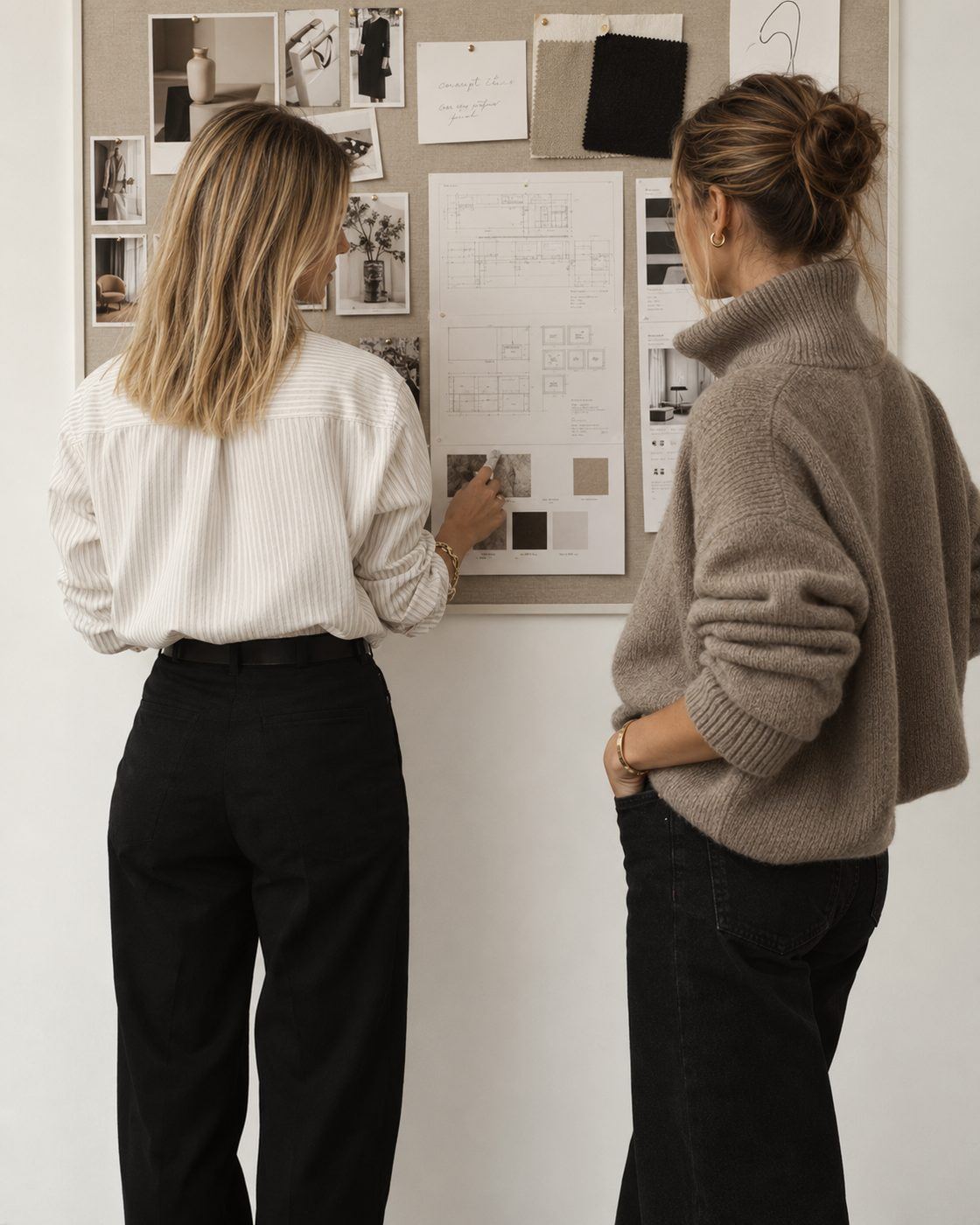 Two women working at a moodboard
